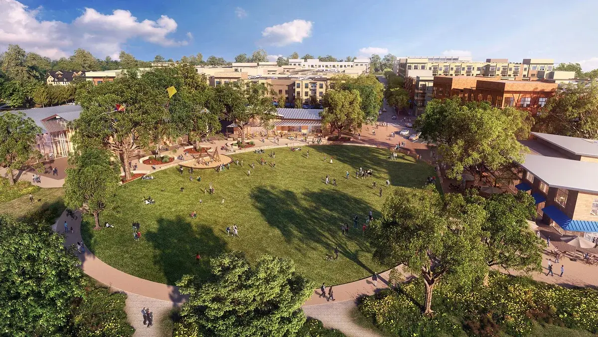 A town center green with shops and gathering space in Cedar Park, Texas, part of the area Podium Body Works serves