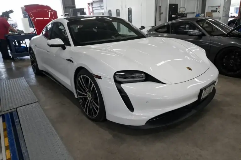 A finished, detailed repaired car ready for customer pickup at Podium Body Works in Round Rock, Texas