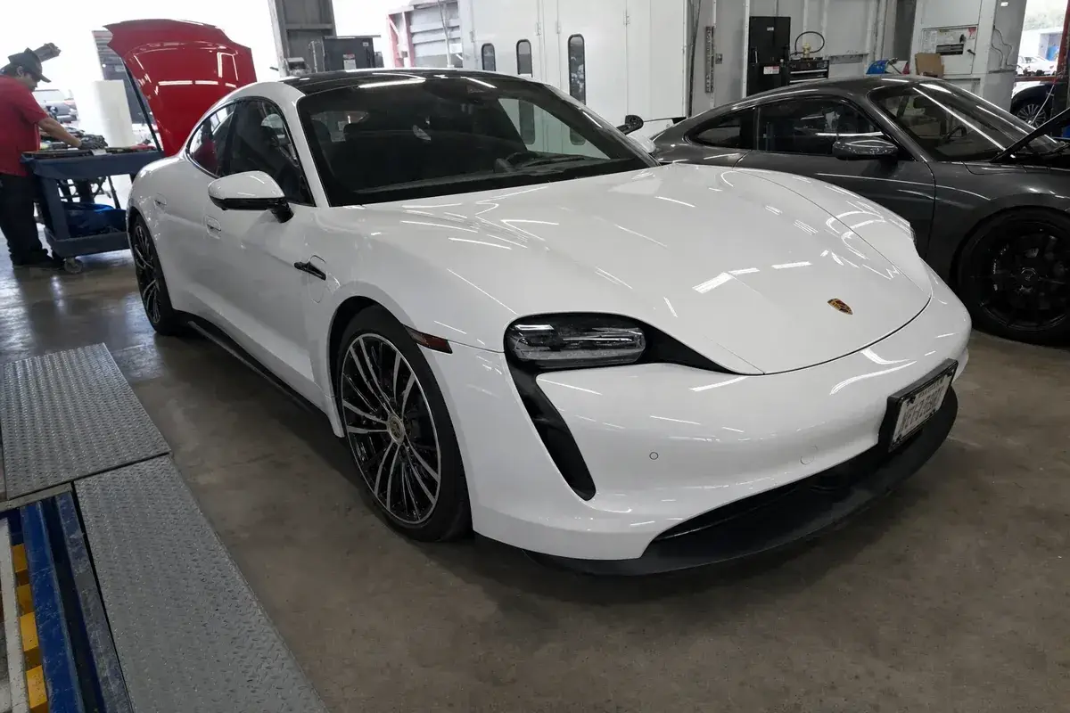A finished, detailed repaired car ready for customer pickup at Podium Body Works in Round Rock, Texas