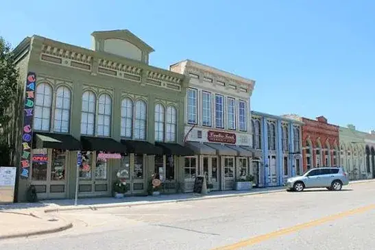 Historic downtown storefronts in Hutto, Texas, part of the area Podium Body Works serves