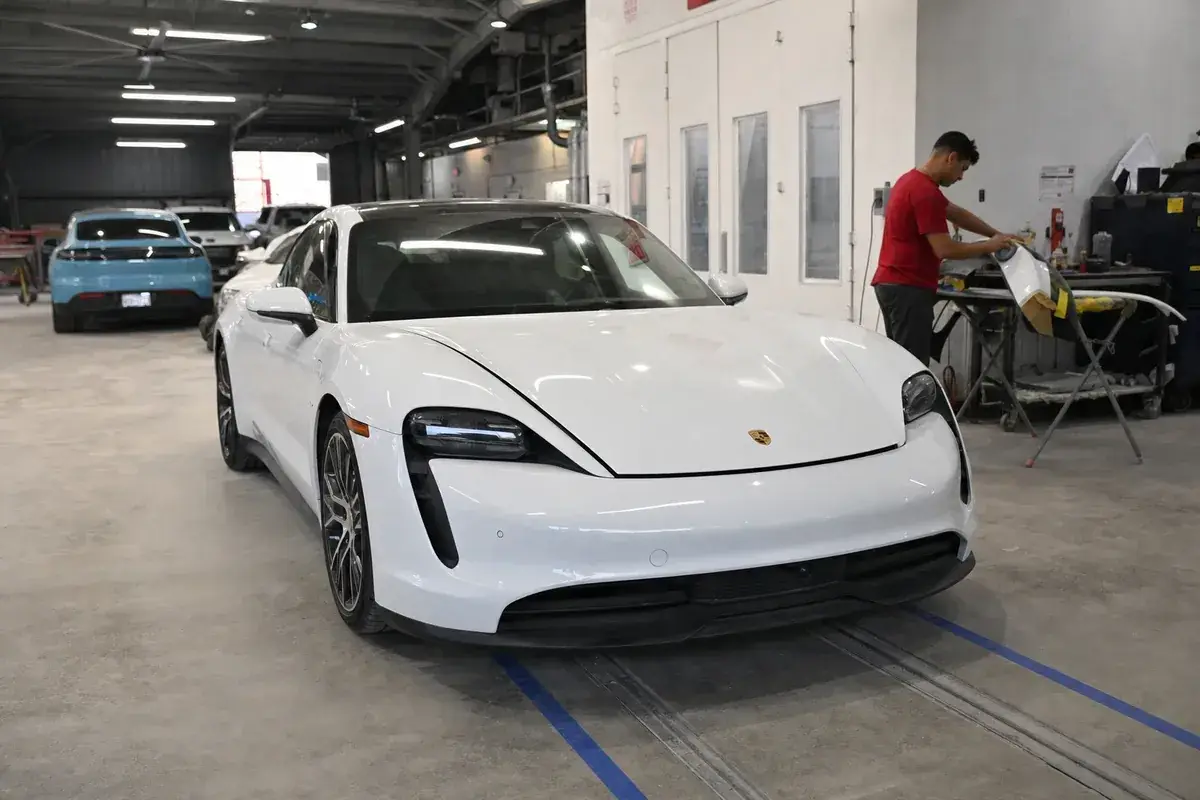 A Porsche in the certified repair bay at Podium Body Works in Liberty Hill, Texas